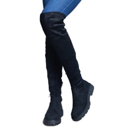 Bottes longues noires à tige souple et semelle plate le noir