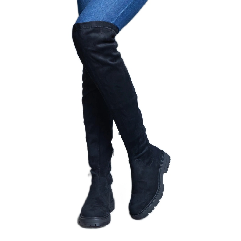 Bottes longues noires à tige souple et semelle plate le noir