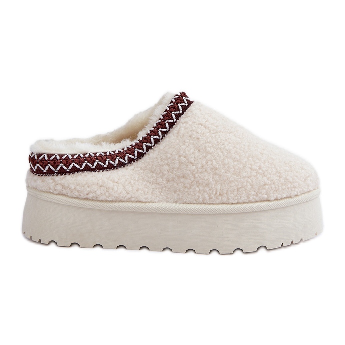 Chaussons en peau de mouton beige clair sur plateforme avec fourrure Chaussons en peau de mouton beige clair sur plateforme avec fourrure
