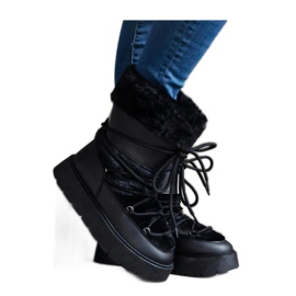 Bottes de neige isolées noires à lacets ornées de fourrure