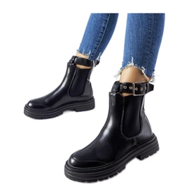 Bottines noires avec fermoir décoratif le noir
