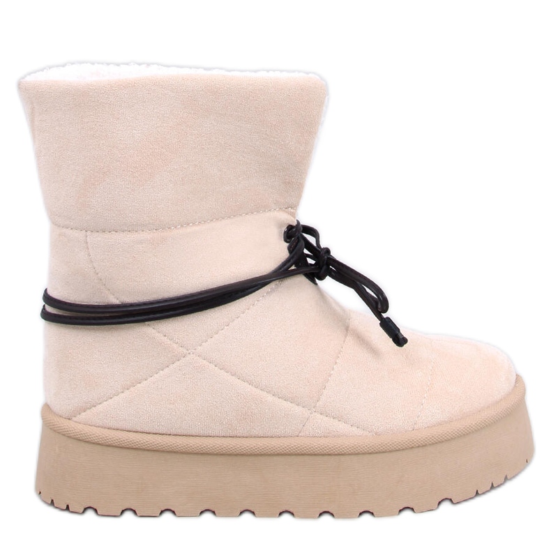 Boots de neige en peau de mouton beige