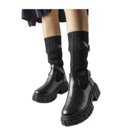 Bottes élégantes noires avec une tige élastique