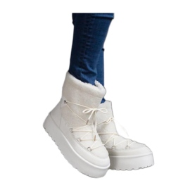 Bottines de neige à plateforme blanches avec fourrure