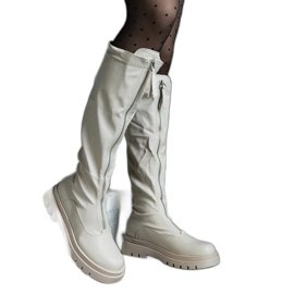 Bottines beiges en éco-cuir à talon plat ornées d'une fermeture éclair