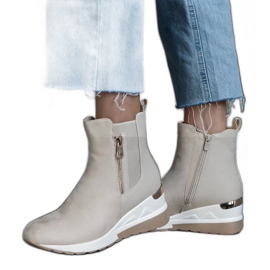 Bottines de sport beiges à semelles compensées