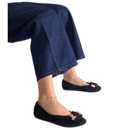 Ballerines noires ornées d'un nœud et d'une broche le noir
