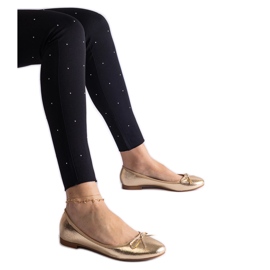 Ballerines dorées ornées d'un nœud