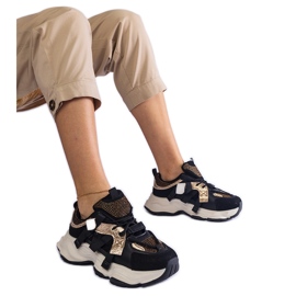 Baskets noires avec empiècements dorés le noir