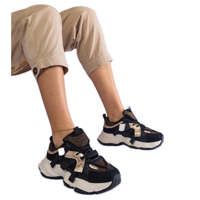 Baskets noires avec empiècements dorés le noir