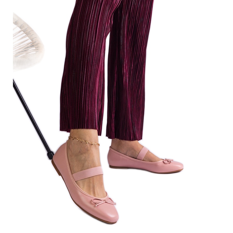 Ballerines roses avec une bande élastique et un arc décoratif