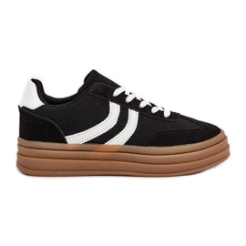 Baskets élégantes sur la plate-forme en noir et blanc le noir