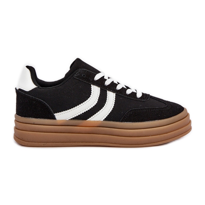 Baskets élégantes sur la plate-forme en noir et blanc le noir
