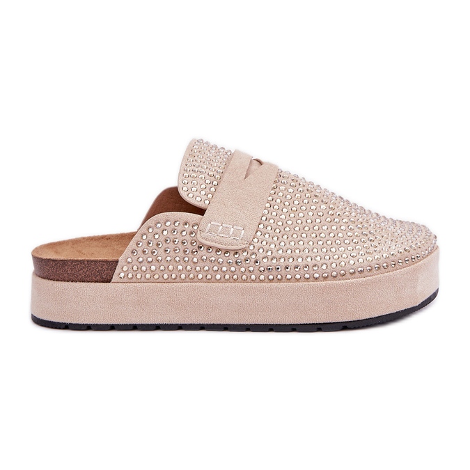 Des pantoufles pour femmes décorées de zircons sur la plate-forme beige
