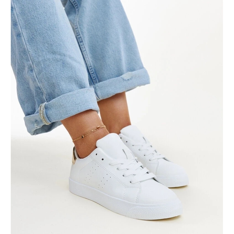 Baskets Akila blanches et dorées Baskets Akila blanches et dorées