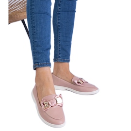 Mocassins roses décorés d'un arc et d'un ours en peluche doré