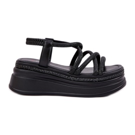Sandales sur une plate-forme massive avec des rayures noires le noir