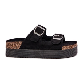 Slippers pour femmes sur une plate-forme massive avec des boucles noires le noir