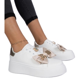 Baskets blanches et or pour femmes avec un arc