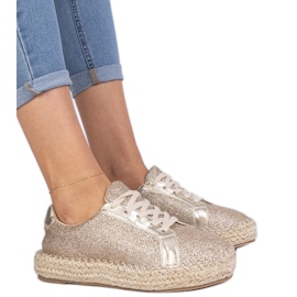 Espadrilles féminines dorées décorées de paillettes d'or