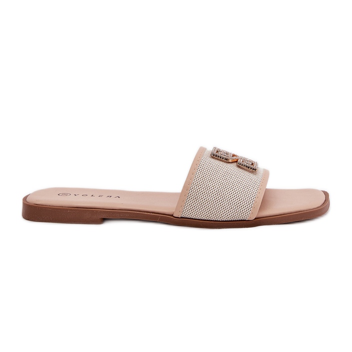 Les tongs élégants pour femmes avec une décoration plate décoration beige