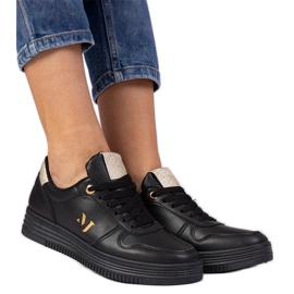 Baskets noires avec des paillettes dorées le noir