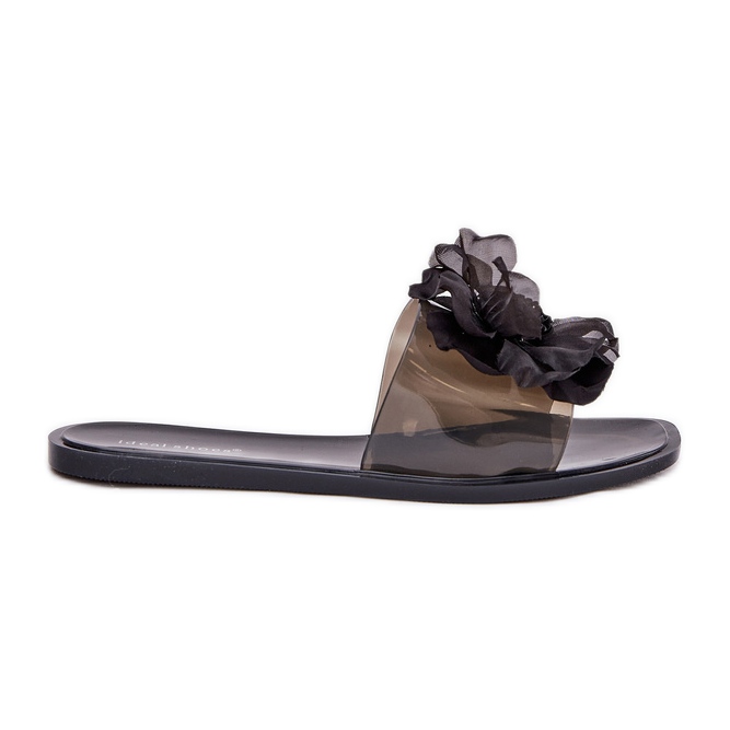 Les tongs des femmes plates transparentes avec un noir de fleur artificielle le noir Les tongs des femmes plates transparentes avec un noir de fleur artificielle le noir