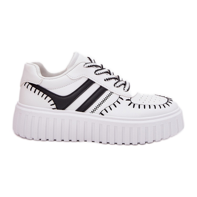 Baskets féminines sur la plate-forme blanche et blanche Baskets féminines sur la plate-forme blanche et blanche