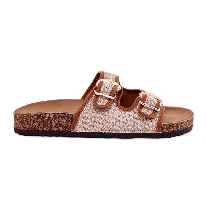 Les tongs matériels des femmes sur une plate-forme en liège avec des boucles de chameau brun