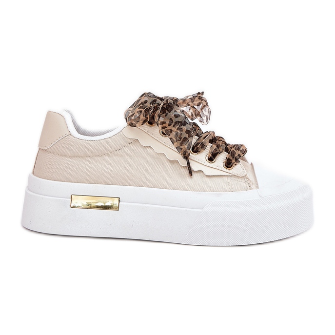 Baskets pour femmes sur une plate-forme massive avec un laçage décoratif beige Baskets pour femmes sur une plate-forme massive avec un laçage décoratif beige