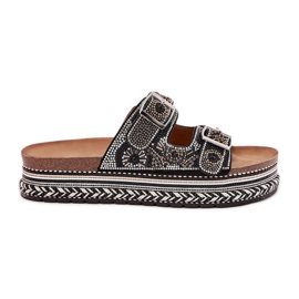 Pantoufles avec décoration et boucles sur la plate-forme noire