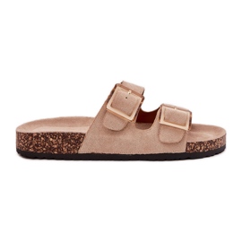Les tongs des femmes avec des pinces sur une semelle en liège beige