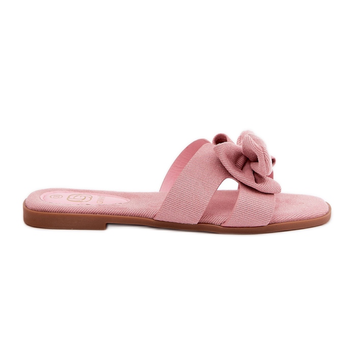 Les tongs plats des femmes avec un arc rose
