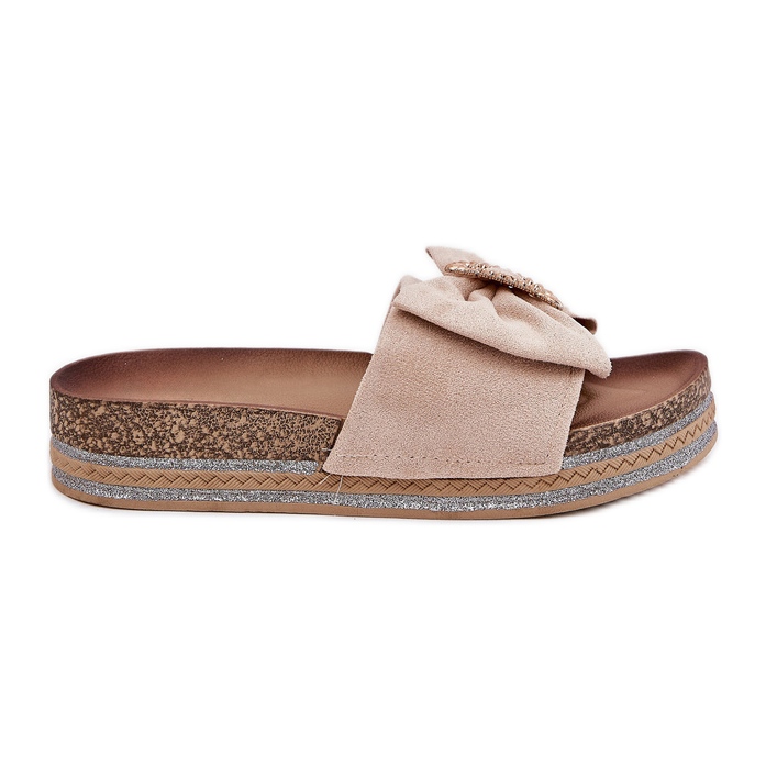 Les tongs pour femmes sur la plate-forme avec un arc et une broche décorative beige Les tongs pour femmes sur la plate-forme avec un arc et une broche décorative beige