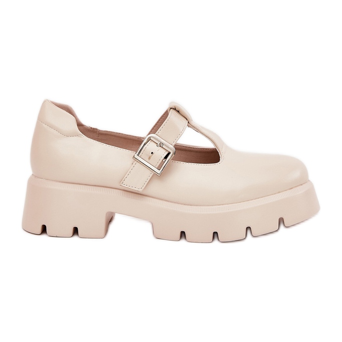 Chaussures de femmes avec une boucle sur la plate-forme et des talons plats beige