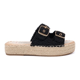 Seastar Les tongs noirs sur la plate-forme avec des boucles