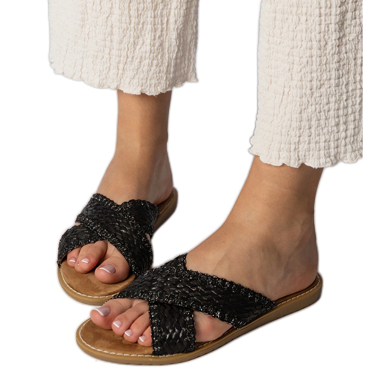 Slippers des femmes noires le noir