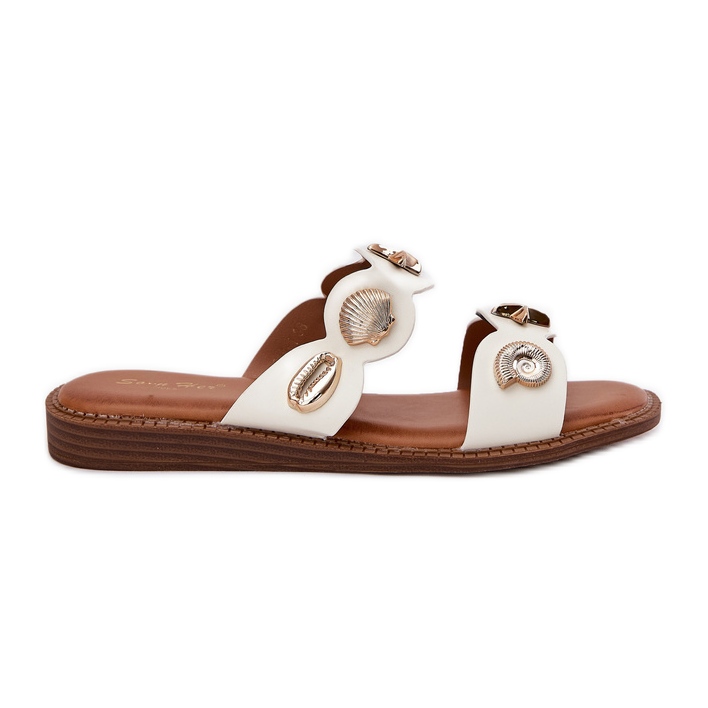 Les tongs des femmes avec des épingles dorées blanches Les tongs des femmes avec des épingles dorées blanches