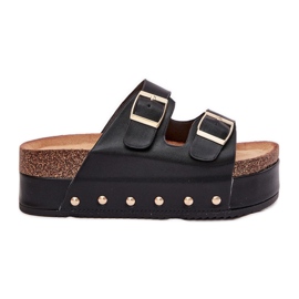 Les tongs pour femmes avec des boucles sur une plate-forme massive noire le noir