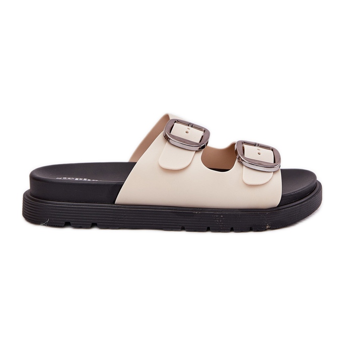 Les tongs pour femmes avec des boucles sur la plate-forme beige