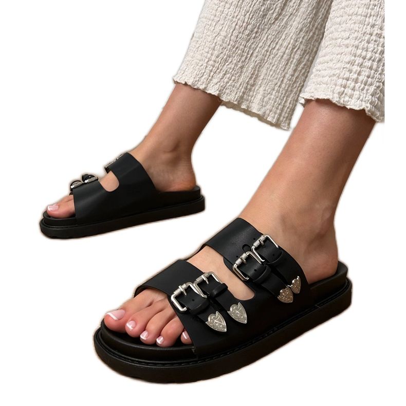 Slippers pour femmes noires avec boucles décoratives le noir