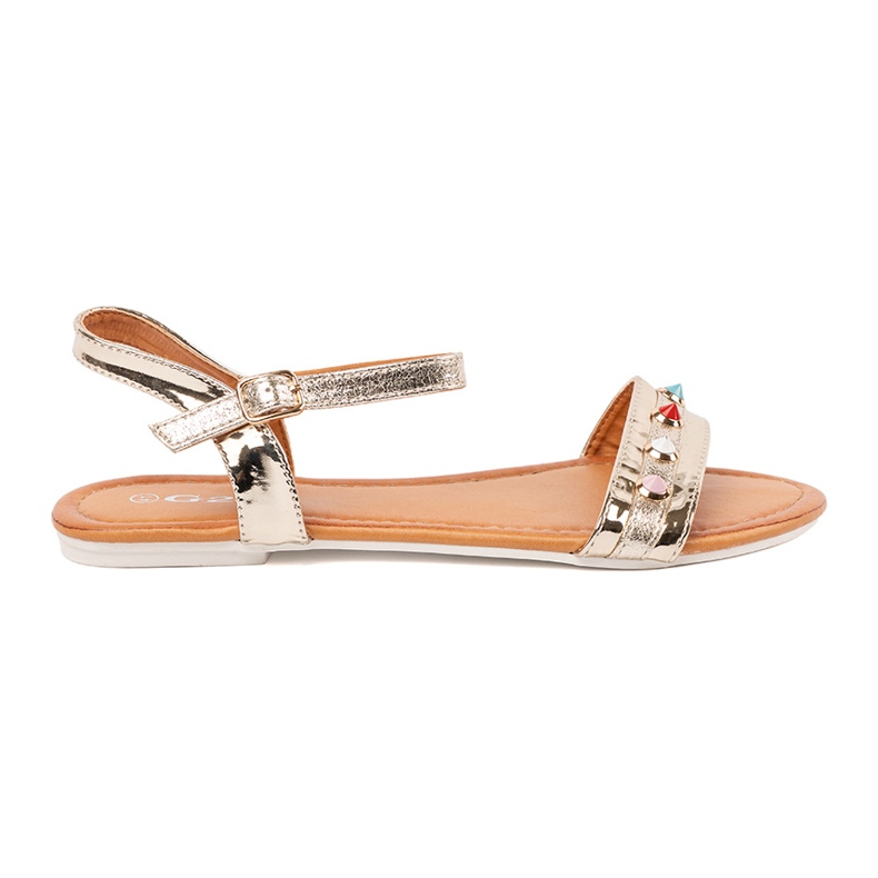 Sandales plates dorées avec des goujons colorés