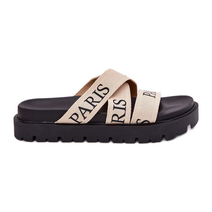 Les tongs pour femmes avec des rayures matérielles parisiennes sur la plate-forme beige