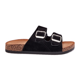 Slippers pour femmes sur une plate-forme en liège avec des pinces noires