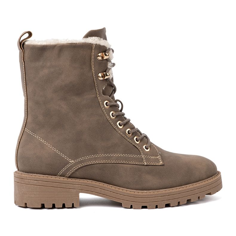 Shelvt Des bottes beige sombres élégantes avec une semelle épaisse