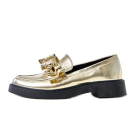 Mocassins dorés avec un arc et un ours en peluche teriwa