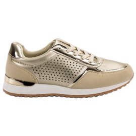 Chaussures de sport dorées d'or Chaussures de sport dorées d'or