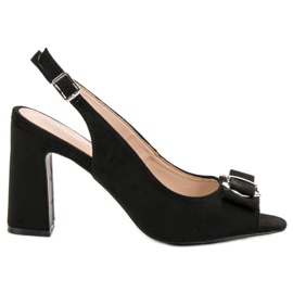 SHELOVET sandales sur un bar noir