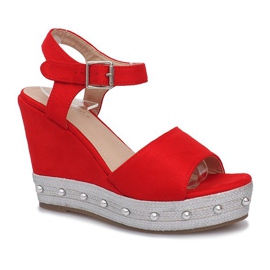 Sandales compensées rouges de voyage