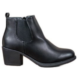Anesia Paris Bottines noires sur un poteau